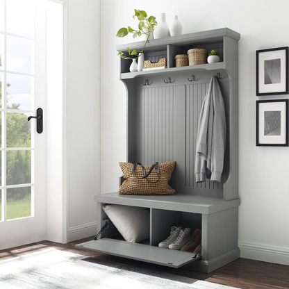 Front view of an entryway storage rack in gray color showing storage cubicles and coat rack