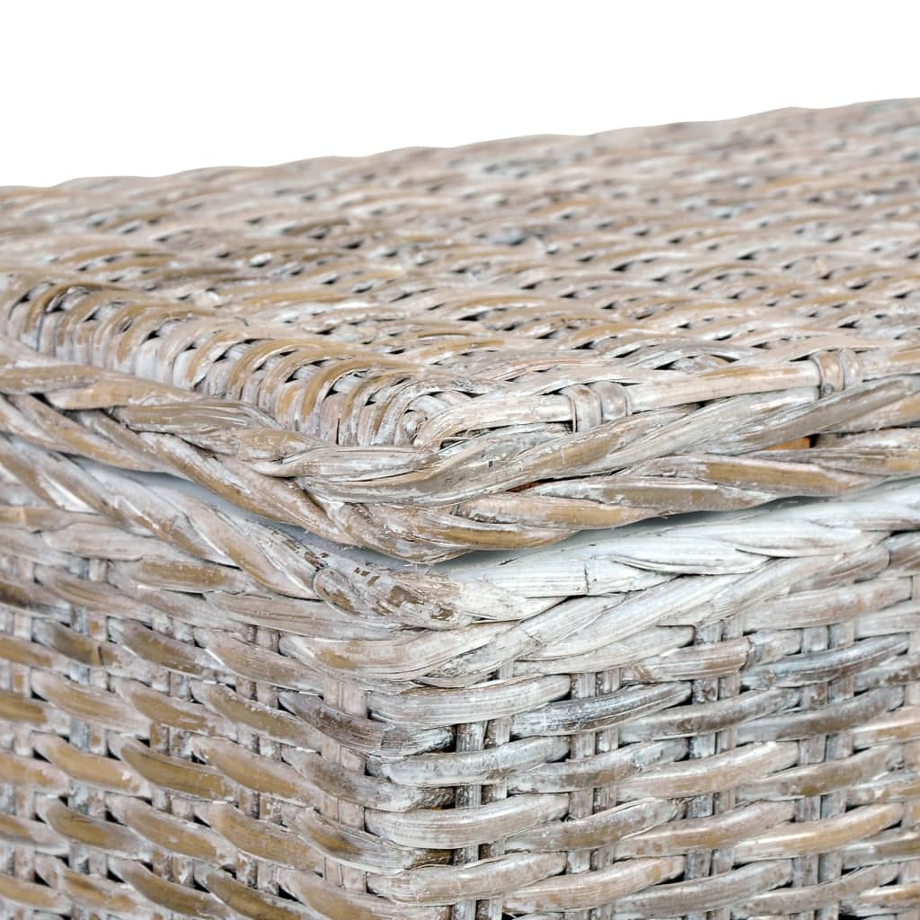 Top corner view of a storage bench made of solid wood and covered in rattan wicker